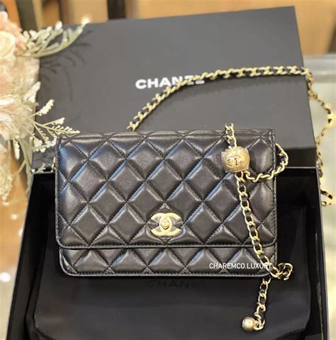 chanel gold ball woc|Chanel handbags on chain.